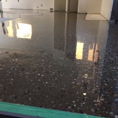 Detailed view of freshly acid stained concrete floor in Waukesha with reflective finish and texture