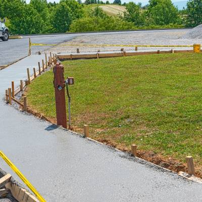 Concrete curbs installation process in Brookfield, Wisconsin on a sunny day