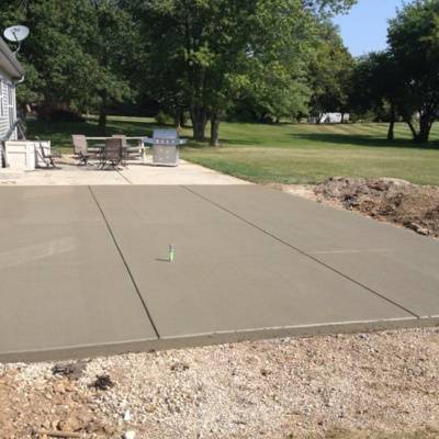 Custom concrete patio installation in Waukesha WI during sunny weather