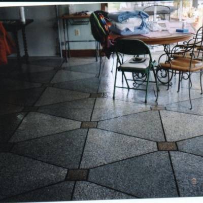 Decorative stained concrete flooring enhances interior space in Waukesha, showcasing artistry and design