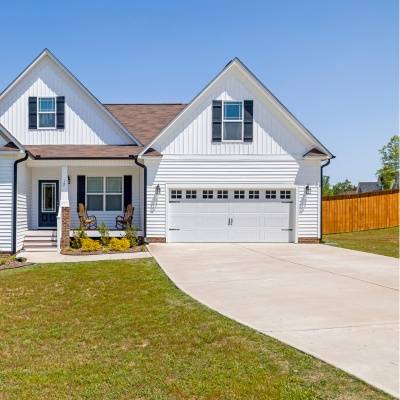 Newly constructed garage floor installation in New Berlin, Wisconsin enhancing home exterior appeal